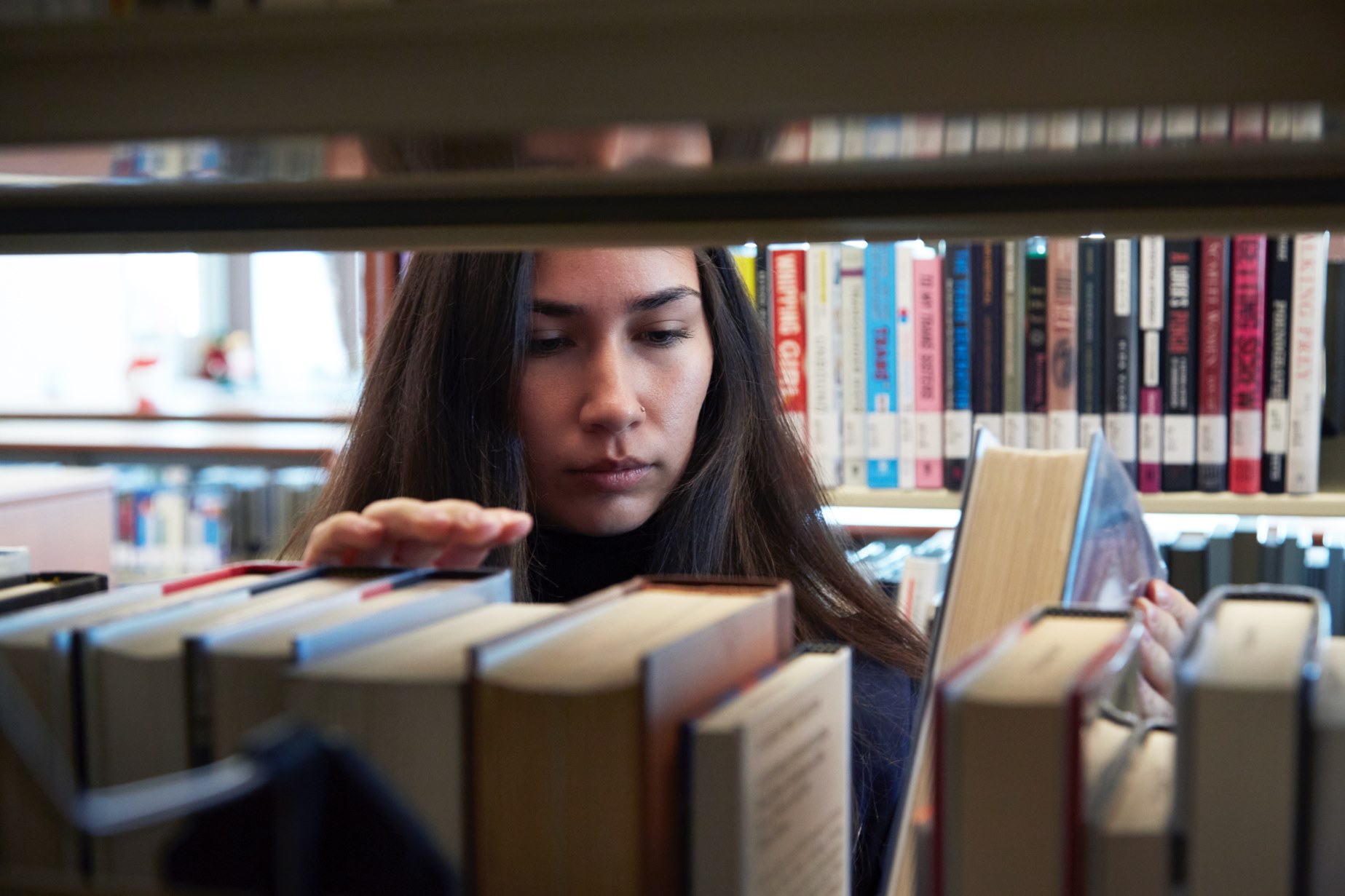 ostensibly fiscally secure student looking at books regarding fiscal services presumably